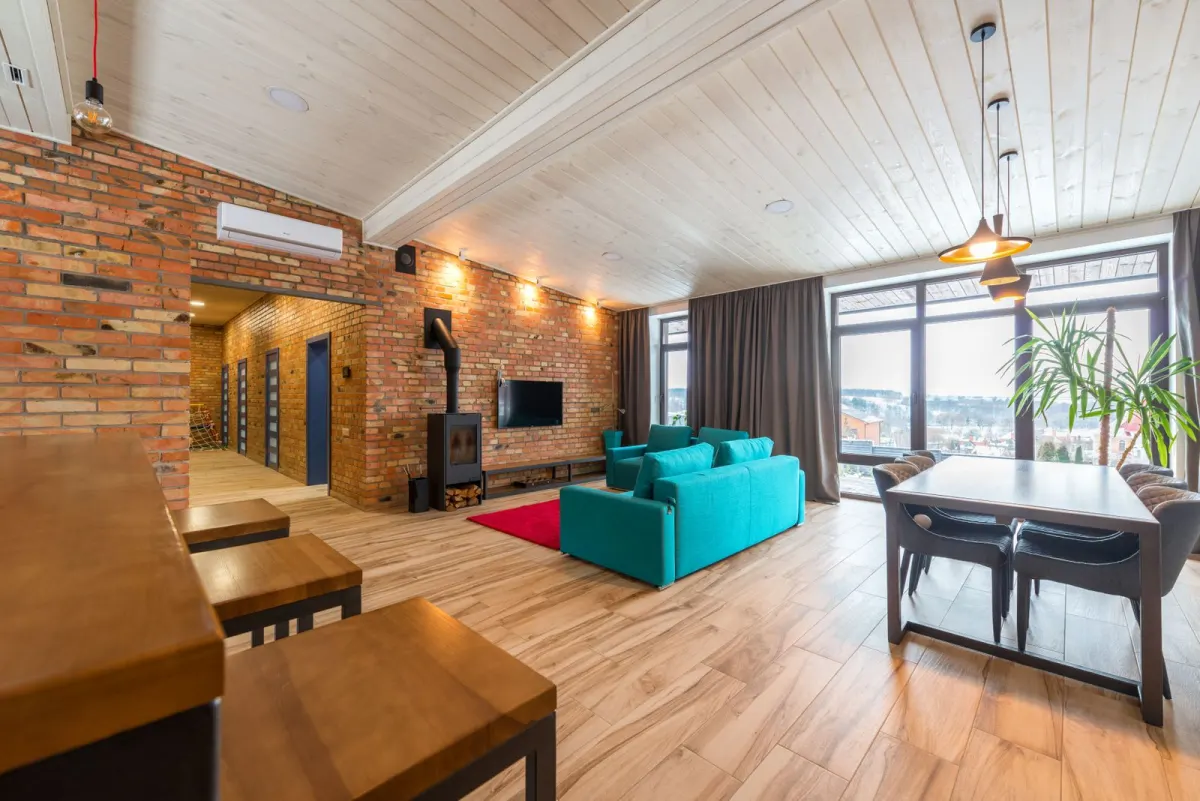 Loft with exposed brick walls and large windows